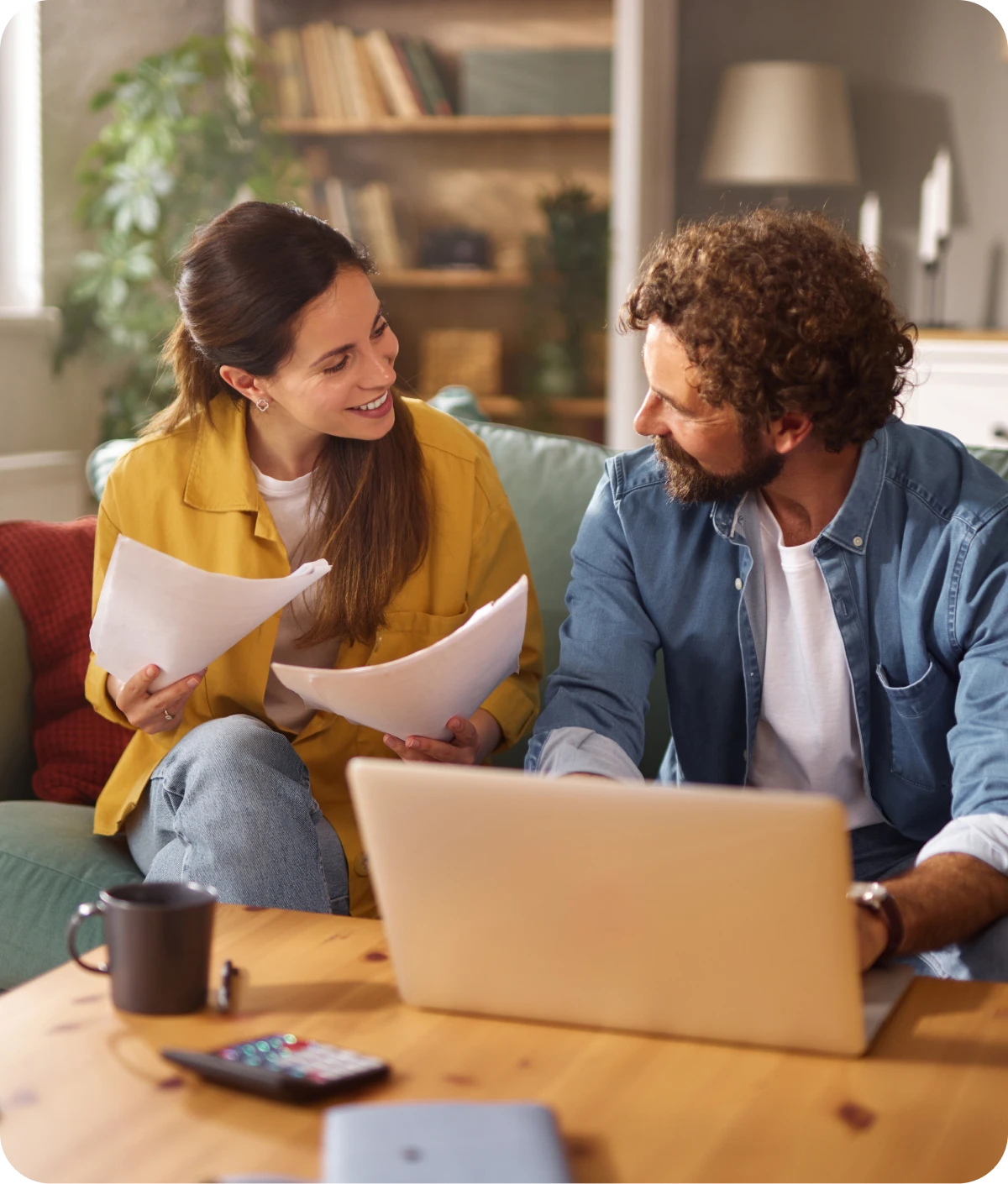 Couple discussing documents at home